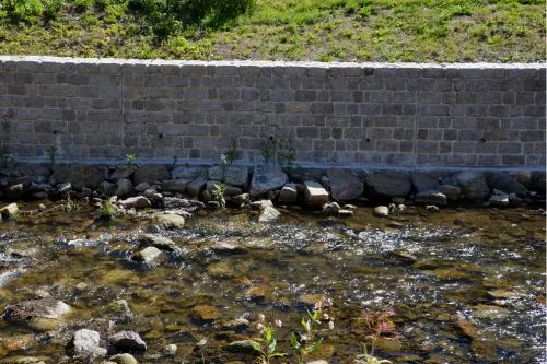 Retaining wall leaning due to poor drainage