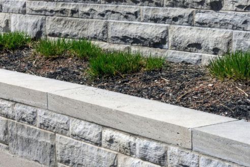 Concrete retaining wall close to a curb