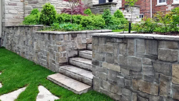 Natural Stone Retaining Wall in Backyard