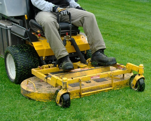 Landscaper moving a lawn